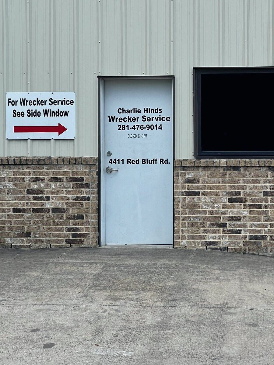 Charlie Hinds Wrecker Service office door at 4411 Red Bluff Rd., Pasadena